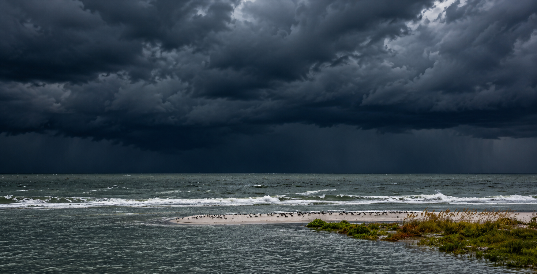 Storm clouds approaching the Florida coast over the ocean